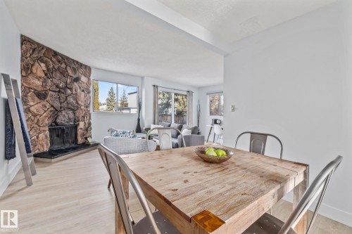 5612 92C Avenue, Edmonton, AB - Indoor Photo Showing Dining Room With Fireplace