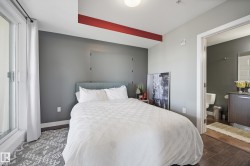 Bedroom with wood finished floors and baseboards - 