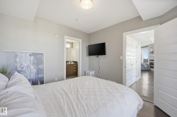 Bedroom with wood finished floors and ensuite bathroom - 
