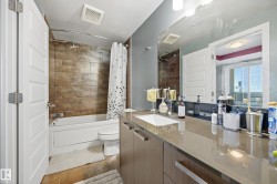Full bath featuring vanity and shower / bathtub combination with curtain - 