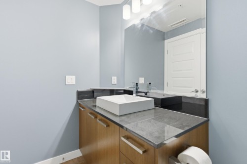 Bathroom featuring vanity and baseboards - 2003 10388 105 Street, Edmonton, AB - Indoor Photo Showing Bathroom