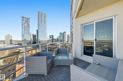 Balcony featuring outdoor seating and a skyline view - 