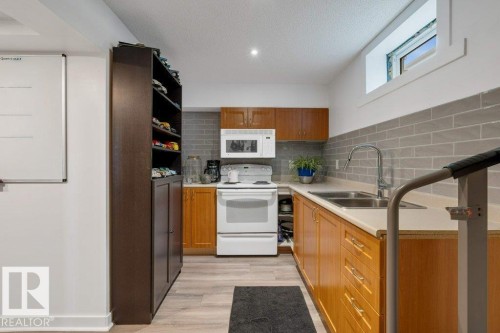 7611 141 Avenue Nw, Edmonton, AB - Indoor Photo Showing Kitchen With Double Sink