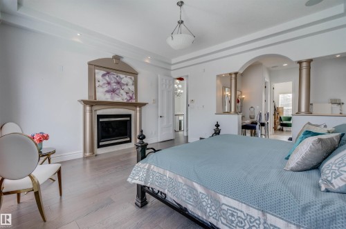 251 Galland Close, Edmonton, AB - Indoor Photo Showing Bedroom With Fireplace