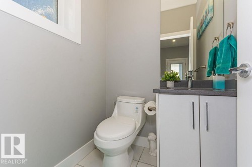 Bathroom featuring vanity and tile patterned flooring - 1224 Mcconachie Boulevard, Edmonton, AB - Indoor Photo Showing Bathroom