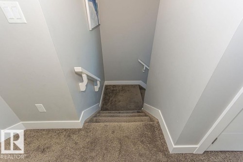 Stairway featuring carpet flooring - 1224 Mcconachie Boulevard, Edmonton, AB - Indoor Photo Showing Other Room