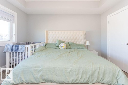 Carpeted bedroom featuring baseboards - 1224 Mcconachie Boulevard, Edmonton, AB - Indoor Photo Showing Bedroom