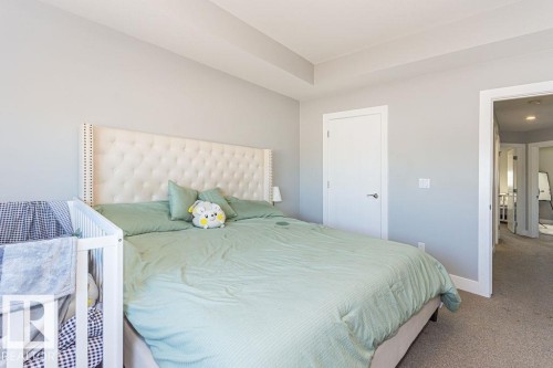 Carpeted bedroom featuring baseboards - 1224 Mcconachie Boulevard, Edmonton, AB - Indoor Photo Showing Bedroom