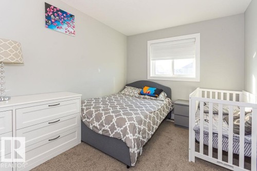 Bedroom with light carpet - 1224 Mcconachie Boulevard, Edmonton, AB - Indoor Photo Showing Bedroom