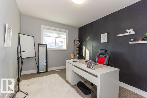 Home office featuring baseboards and light colored carpet - 1224 Mcconachie Boulevard, Edmonton, AB - Indoor
