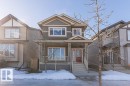 Craftsman-style home featuring a porch - 1224 Mcconachie Boulevard, Edmonton, AB  - Outdoor With Facade 