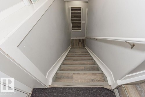 Stairs featuring wood finished floors - 1224 Mcconachie Boulevard, Edmonton, AB - Indoor Photo Showing Other Room