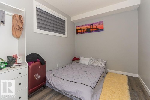 Bedroom featuring wood finished floors and baseboards - 1224 Mcconachie Boulevard, Edmonton, AB - Indoor Photo Showing Bedroom