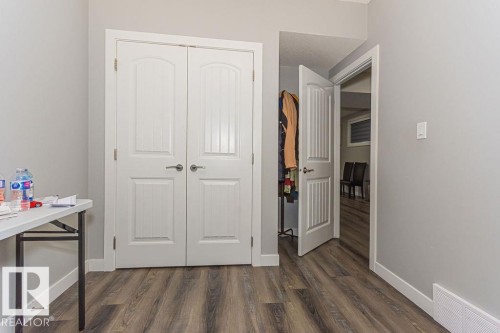 Bedroom featuring dark wood-style floors and a closet - 1224 Mcconachie Boulevard, Edmonton, AB - Indoor