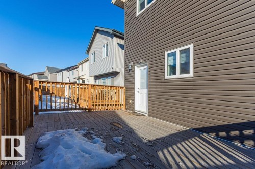 Wooden terrace featuring a residential view - 1224 Mcconachie Boulevard, Edmonton, AB - Outdoor With Exterior