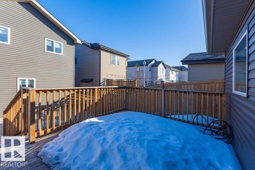 Wooden terrace with a residential view - 1224 Mcconachie Boulevard, Edmonton, AB - Outdoor With Exterior