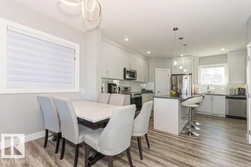 Dining space featuring light wood finished floors and recessed lighting - 1224 Mcconachie Boulevard, Edmonton, AB - Indoor Photo Showing Other Room