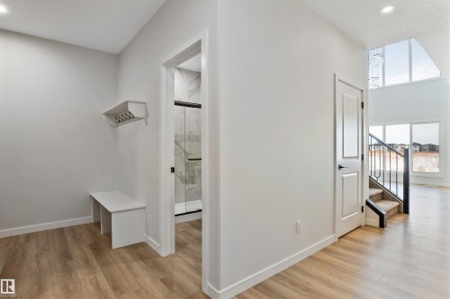 Hallway with light wood-style floors and recessed lighting - 112 25 Street, Edmonton, AB - Indoor Photo Showing Other Room