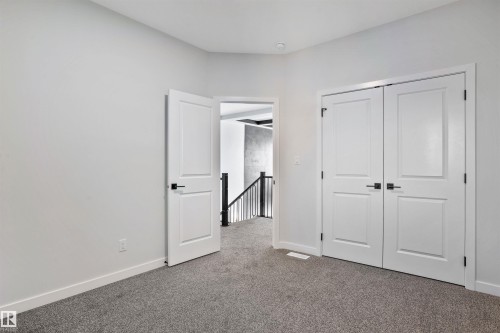 Unfurnished bedroom featuring carpet and a closet - 112 25 Street, Edmonton, AB - Indoor Photo Showing Other Room