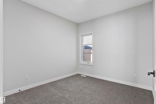 Empty room featuring baseboards and carpet - 112 25 Street, Edmonton, AB - Indoor Photo Showing Other Room