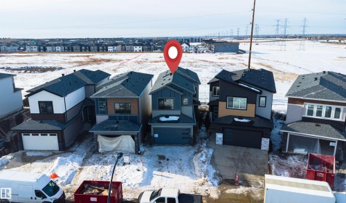Snowy aerial view featuring a residential view - 112 25 Street, Edmonton, AB - Outdoor With Facade