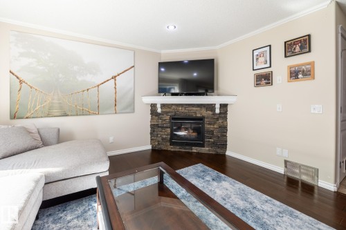 228 Hyndman Crescent, Edmonton, AB - Indoor Photo Showing Living Room With Fireplace