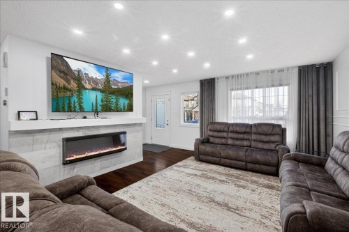 1472 33A Street, Edmonton, AB - Indoor Photo Showing Living Room With Fireplace