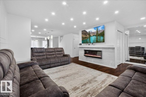 1472 33A Street, Edmonton, AB - Indoor Photo Showing Living Room With Fireplace