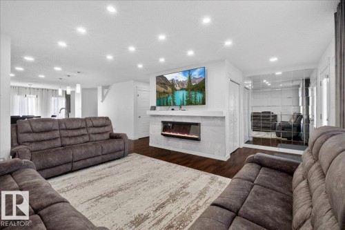 1472 33A Street, Edmonton, AB - Indoor Photo Showing Living Room With Fireplace