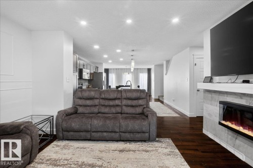 1472 33A Street, Edmonton, AB - Indoor Photo Showing Living Room With Fireplace