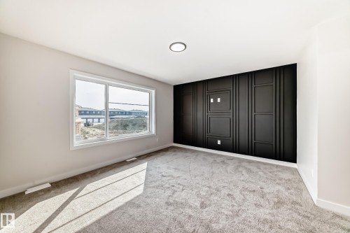 Empty room with light carpet and baseboards - 135 Pierwyck Loop, Spruce Grove, AB - Indoor Photo Showing Other Room