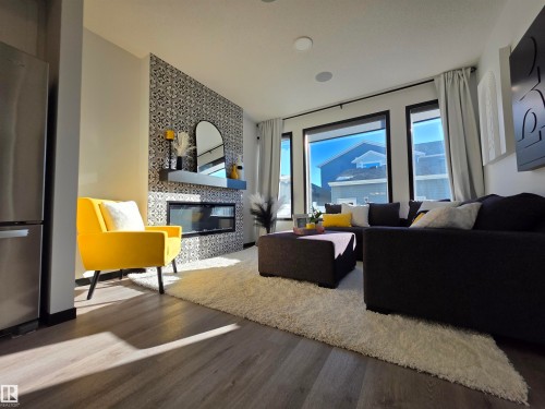 7015 52 Avenue, Beaumont, AB - Indoor Photo Showing Living Room With Fireplace