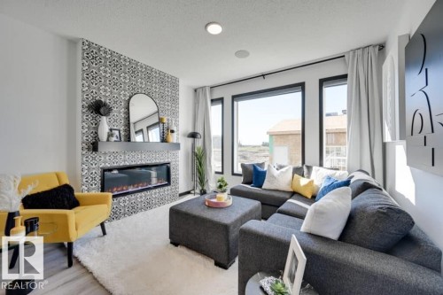 7015 52 Avenue, Beaumont, AB - Indoor Photo Showing Living Room With Fireplace