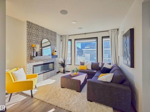 7015 52 Avenue, Beaumont, AB - Indoor Photo Showing Living Room With Fireplace