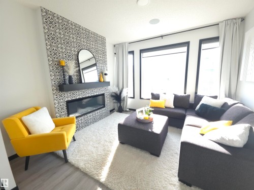 7015 52 Avenue, Beaumont, AB - Indoor Photo Showing Living Room With Fireplace