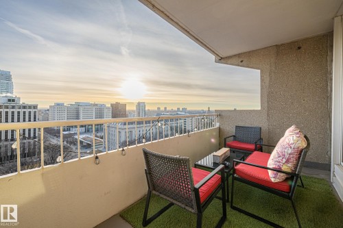 Balcony at dusk with a city view - 1502 9909 110 Street, Edmonton, AB - Outdoor With Exterior