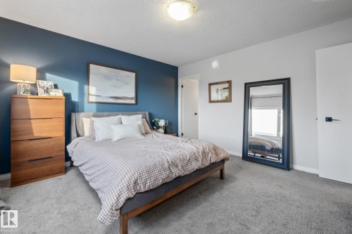 Bedroom with carpet and a textured ceiling - 1502 9909 110 Street, Edmonton, AB - Indoor Photo Showing Bedroom