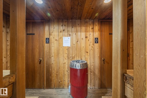 Relaxing sauna / steam room with wood walls, wood ceiling, hardwood / wood-style floors, and recessed lighting - 1502 9909 110 Street, Edmonton, AB - Indoor Photo Showing Other Room