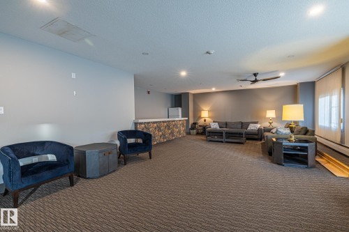 Lobby with a textured ceiling and recessed lighting - 1502 9909 110 Street, Edmonton, AB - Indoor