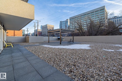 View of yard with a patio area, a pergola, and a view of city - 1502 9909 110 Street, Edmonton, AB - Outdoor