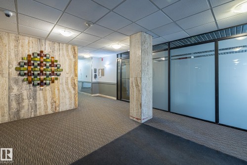 Community lobby with a paneled ceiling - 1502 9909 110 Street, Edmonton, AB - Indoor Photo Showing Other Room
