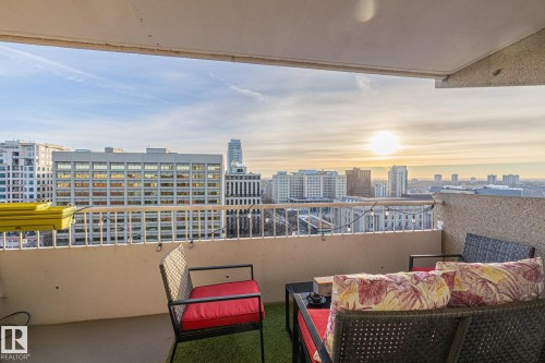 Balcony at dusk with a view of skyline and an outdoor lounge area - 1502 9909 110 Street, Edmonton, AB - Outdoor
