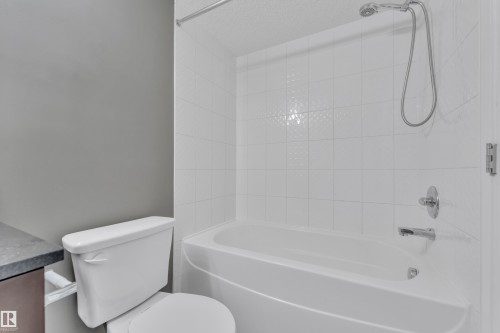 Full bath featuring vanity and shower / bath combination - 216 5804 Mullen Place, Edmonton, AB - Indoor Photo Showing Bathroom