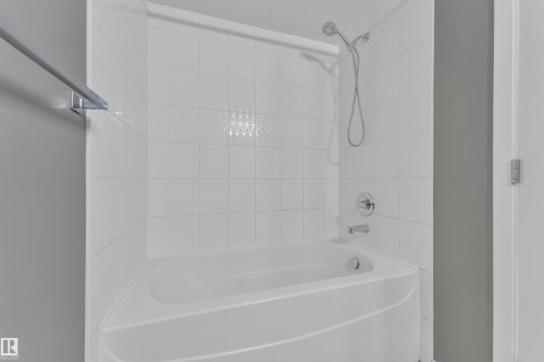 Full bath with washtub / shower combination - 216 5804 Mullen Place, Edmonton, AB - Indoor Photo Showing Bathroom