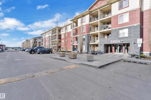 View of apartment building / complex featuring uncovered parking - 216 5804 Mullen Place, Edmonton, AB - Outdoor With Balcony With Facade
