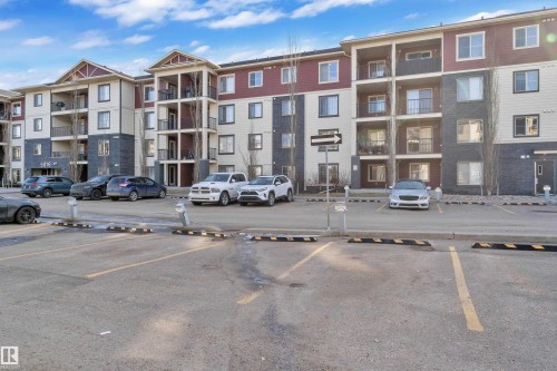 View of apartment building / complex with uncovered parking - 216 5804 Mullen Place, Edmonton, AB - Outdoor With Balcony With Facade