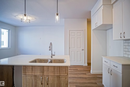 1027 14 Avenue, Edmonton, AB - Indoor Photo Showing Kitchen With Double Sink