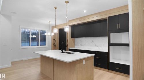 56 Meadowgrove Landing, Spruce Grove, AB - Indoor Photo Showing Kitchen With Double Sink
