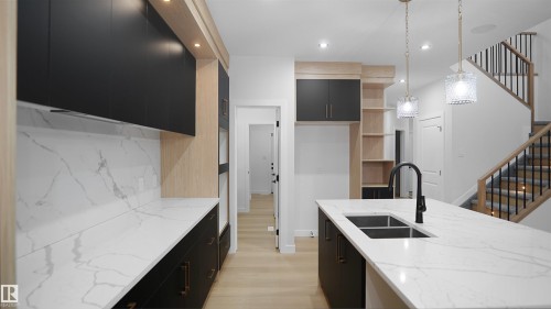 56 Meadowgrove Landing, Spruce Grove, AB - Indoor Photo Showing Kitchen With Double Sink