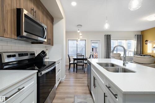 73 Garneau Gate, Spruce Grove, AB - Indoor Photo Showing Kitchen With Double Sink With Upgraded Kitchen